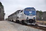 "Texas Eagle" rolls west past a maifest in the siding